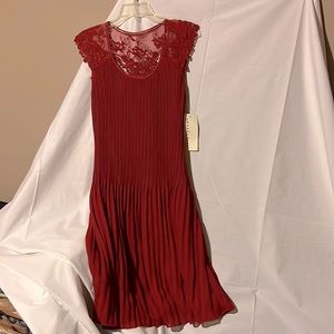 Beautiful Amanda Lane Dress Size 10. NWT. Intricate details. Braided belt.